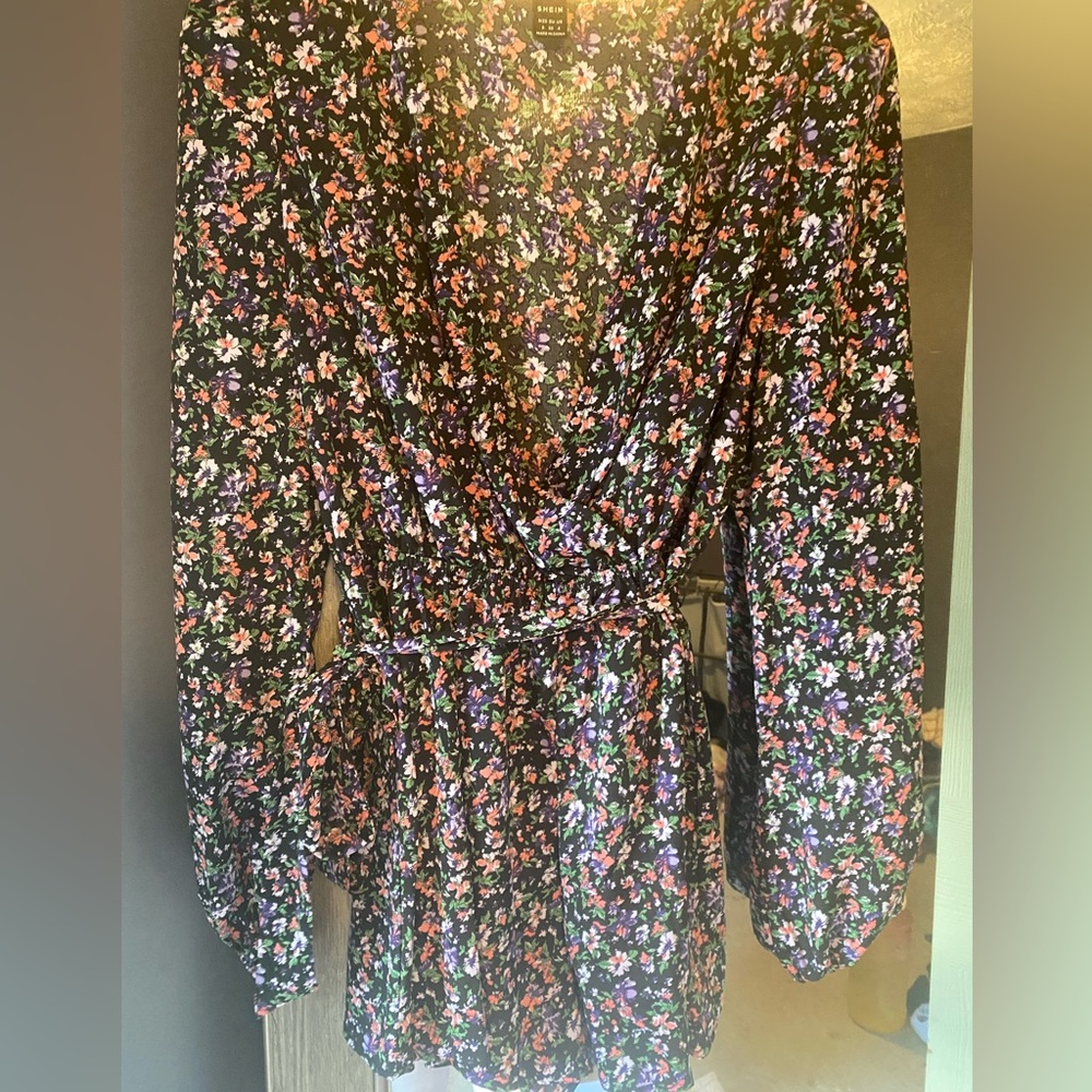 Long sleeve romper size small. Never worn
